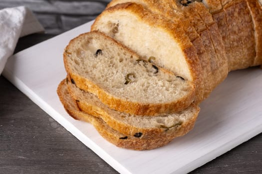 Olives bread on a cutting board.