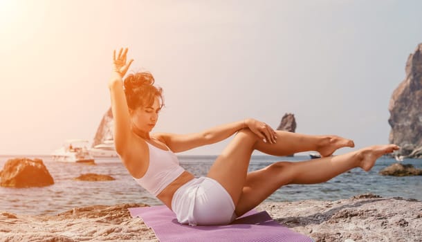 Fitness woman sea. Outdoor workout on yoga mat in park near to ocean beach. Female fitness pilates yoga routine concept. Healthy lifestyle. Happy fit woman exercising with rubber band in park.