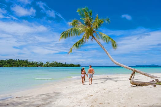 Tropical Island Koh Kood or Koh Kut Thailand. Couple men and women on vacation in Thailand walking at the beach, holiday concept Island hopping in Eastern Thailand Trang