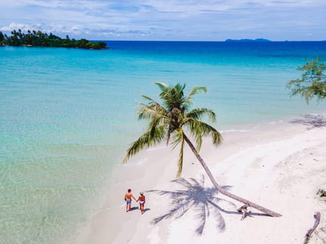 Tropical Island Koh Kood Thailand. Couple men and women on vacation in Thailand walking at the beach, holiday concept Island hopping in Eastern Thailand Trang