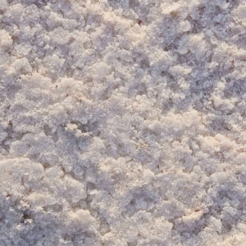 Natural salt Close up. Surface of a salt lake. Natural background. Natural formations of Salt crystals. Top view on Pink salt lake.