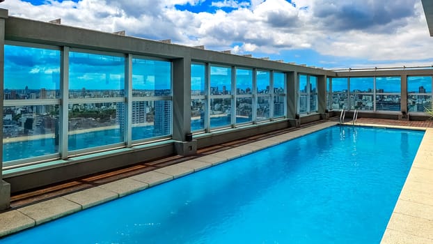 pool on the stress of a skyscraper with a view of the skyline of buenos aires in argentina.