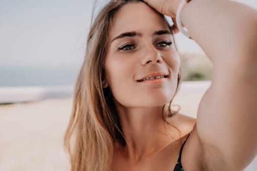 Happy woman portrait in cafe. Boho chic fashion style. Outdoor photo of young happy woman with long hair, sunny weather outdoors sitting in modern cafe