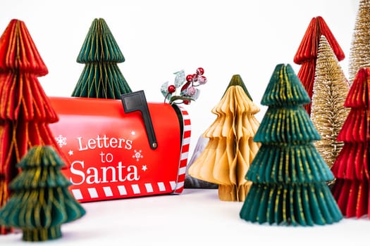 New Year's background for a product or card. Colored Christmas trees, Santa Claus mailbox. High quality photo
