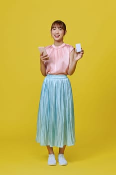 Holding credit card, portrait of asian happy cheerful woman holding credit card