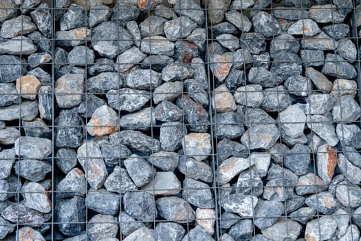 The layer of rock or stone are set up as the wall in some building or factory.