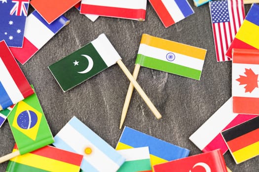 Policy. National flags of different countries. The concept is diplomacy. In the middle among the various flags are two flags - India, Pakistan