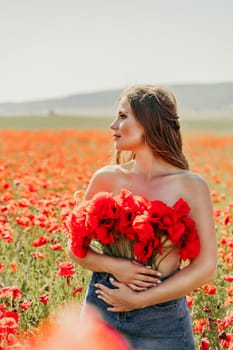 Woman poppies field. portrait of a happy woman with long hair in a poppy field and enjoying the beauty of nature in a warm summer day