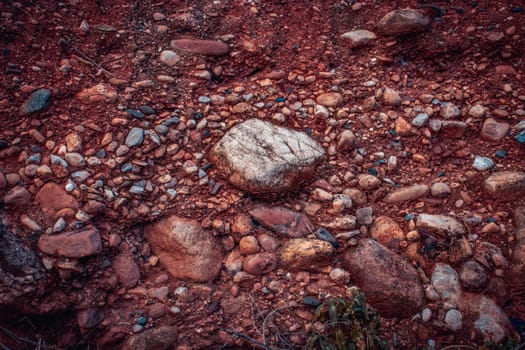 Soil with stones, clay layers photo. Slice of sand with layers of different structures. Layers of sedimentary sandstone rock. High quality picture for article