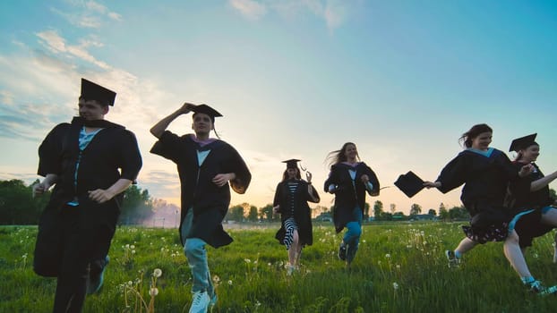 College alumni run at sunset in the evening.