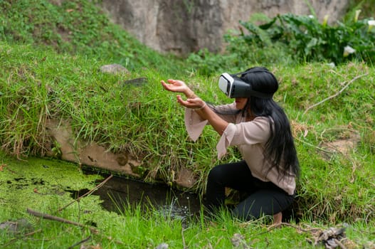 woman inside the metaverse using augmented reality glasses as part of an online training. water day. High quality photo