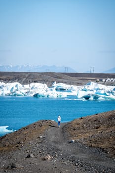 Woman on her back on the Jokulsarlon glacier in spring