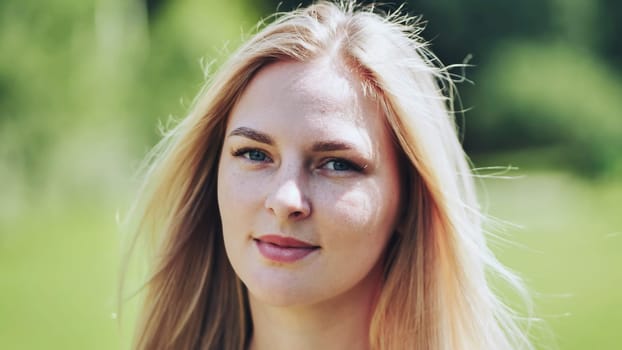 Portrait of a blonde girl of Slavic appearance. Close-up face