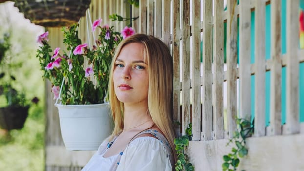 German girl posing outside the house