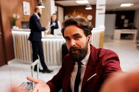 POV of employee calling manager on videoconference online to share international meeting results, hotel lounge area. White collar worker travelling on business trip to forge partnership.