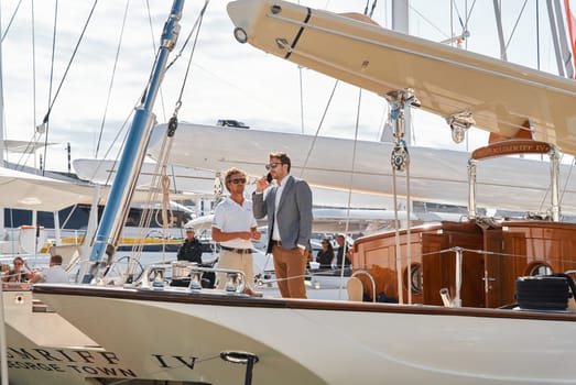 Monaco, Monte Carlo, 29 September 2022 - Invited wealthy clients inspect mega yachts at the largest fair exhibition in the world yacht show MYS, port Hercules, yacht brokers, sunny weather. High quality photo