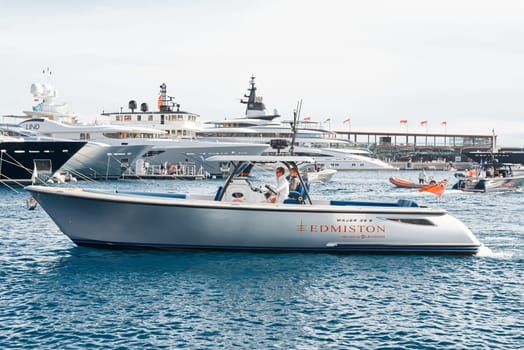 Monaco, Monte Carlo, 29 September 2022 - Water taxi by luxury motorboat on the famous yacht exhibition, a lot of most expensive luxury yachts, richest people, yacht brokers, boat traffic. High quality photo