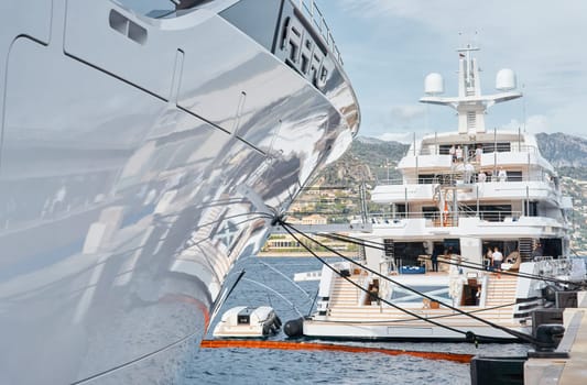 Monaco, Monte Carlo, 29 September 2022 - a lot of luxury yachts at the famous motorboat exhibition, the most expensive boats for the richest people, yacht brokers, boat traffic. High quality photo