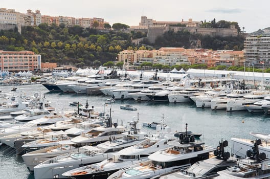 Monaco, Monte Carlo, 29 September 2022 - a lot of luxury yachts at the famous motorboat exhibition, the most expensive boats for the richest people, yacht brokers, boat traffic. High quality photo