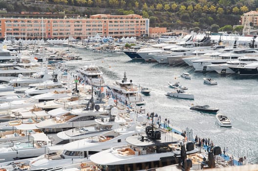 Monaco, Monte Carlo, 29 September 2022 - a lot of luxury yachts at the famous motorboat exhibition, the most expensive boats for the richest people, yacht brokers, boat traffic. High quality photo