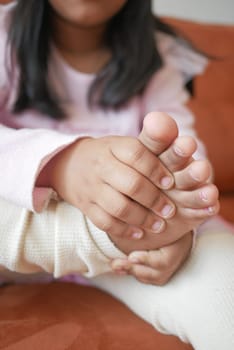 6 year old child suffering pain on feet .