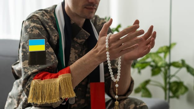Ukrainian military man with prayer beads.