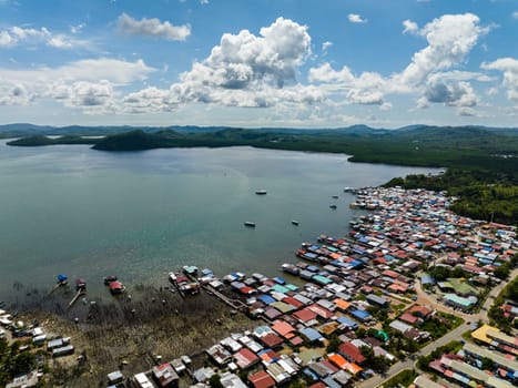 Aerial view of village of fishermen with houses on the water. Kudat, Sabah, Borneo.