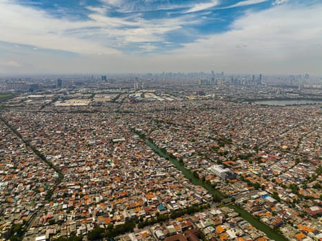 Aerial drone of slums with houses in Jakarta. City Landscape.