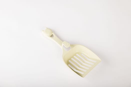Hygiene and cleanliness are at the forefront with isolated metal cat litter scoops on a white background. Keep your cat's litter box fresh and clean for a happy healthy pet.