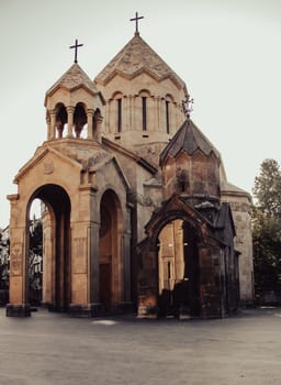 Ancient church with spires in Yerevan cityscape photo. Beautiful urban scenery photography with clear sky on background. High quality picture for wallpaper