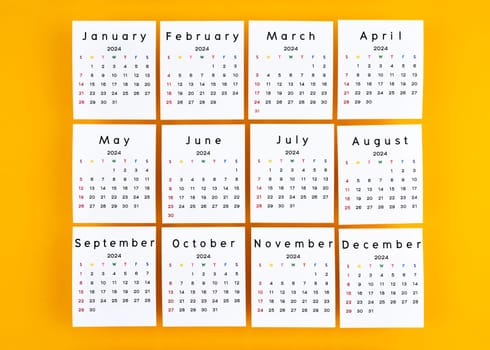 Months 1 to 12 January-December 2024 calendar page on yellow color background.