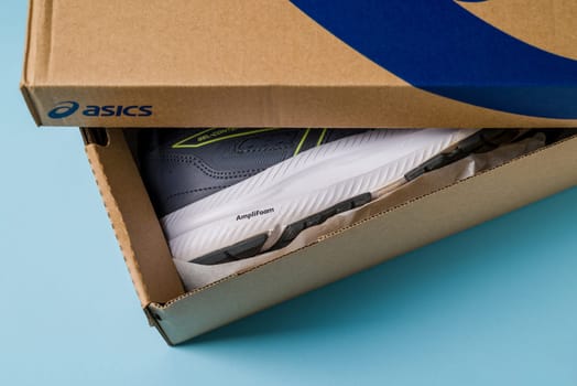 Antalya, Turkey - November 28, 2023: Asics running shoes with new technology soles in shoe box