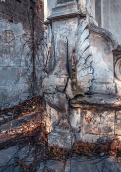 Destroyed swan statue on the yard concept photo. Castle ruins terrace view. Ruined ancient palace in Ukraine. A beautiful historical building in a European city.