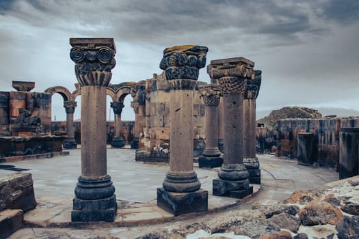 View of ancient column in Zvartnos temple in Armenia concept photo. Beautiful old church scenery photography. High quality picture for magazine, article