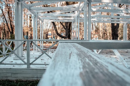 Close up view of the wooden gazebo house in park concept photo. Urban city life. Parkland of European town. High quality altanka picture for wallpaper