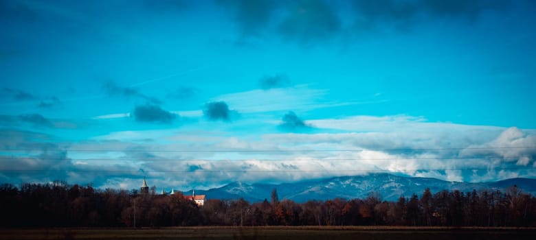 Autumn view of the Pyrenean mountains in Poland concept photo. Beautiful views of Polish countryside church. High quality wallpaper. Ambient cloudy sky.