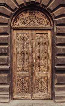 Elegant wooden door old building exterior concept photo. Beautiful urban architectural photography. High quality picture for wallpaper