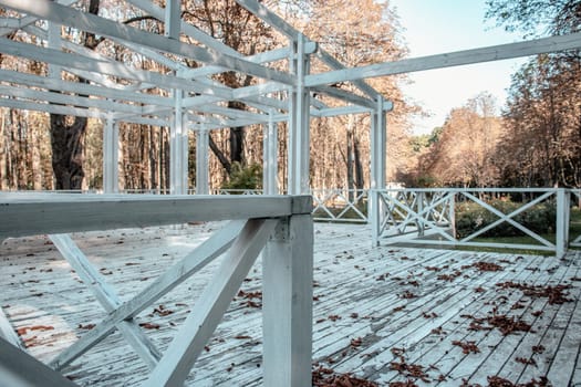 View of the wooden gazebo house in park concept photo. Urban city life. Parkland of European town. High quality altanka picture for wallpaper