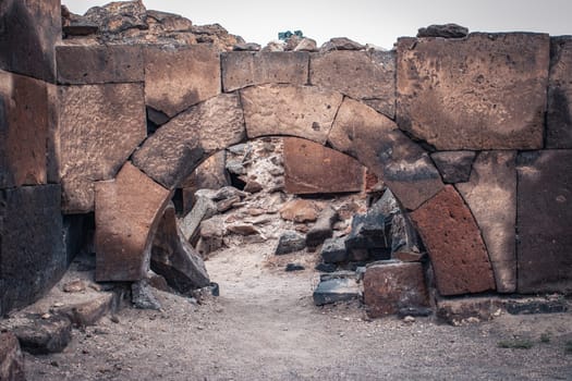 Ruins of an ancient Christian temple close up wall photo. Collapsed church. Zvartnos temple in Armenia. High quality picture for magazine, article