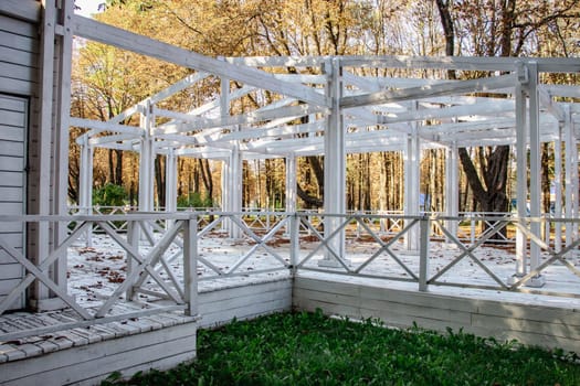 Gazebo in a beautiful public garden park concept photo. Urban city life. Parkland of European town. High quality altanka picture for wallpaper