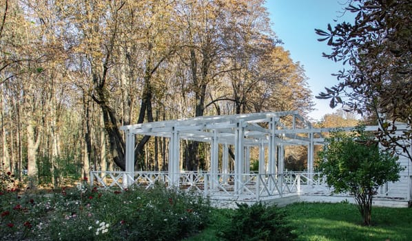 Gazebo in a beautiful public garden park concept photo. Urban city life. Parkland of European town. High quality altanka picture for wallpaper