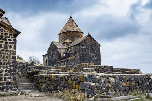 Sevanavank Monastery on the Sevan Peninsula on the shore of Lake Sevan concept photo. Monastery complex on the hill. High quality picture for wallpaper