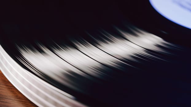 Hypnotic spin of vinyl disc. Timeless cinematic charm of analog music. Audiophile enthusiasts. Perfect for intros, outros, or background visuals. High quality