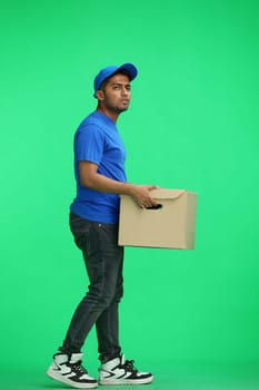 A man on a green background give box.