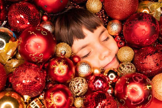 Toddler boys face lights up with joy in Christmas tree toys balls. Wonder, happiness mood. Touch of magic Holiday-themed projects, family-focused content or sentimental storytelling.