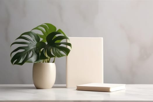 White Book Mockup. White book mockup with a monstera leaf in a vase on a beige table. AI Generated
