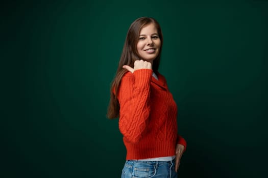 Positive pretty caucasian woman with brown straight hair wearing a red sweater.