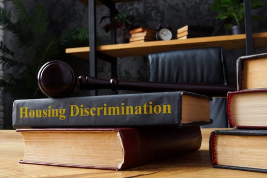 Book with housing discrimination law and a gavel.