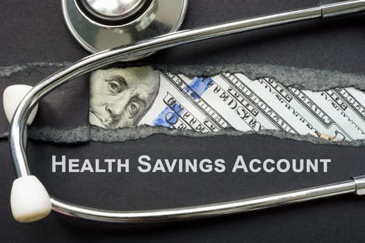 HSA health savings account sign and a stethoscope.