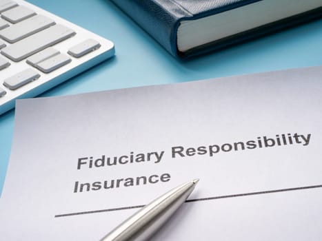 Fiduciary responsibility insurance policy and a pen.